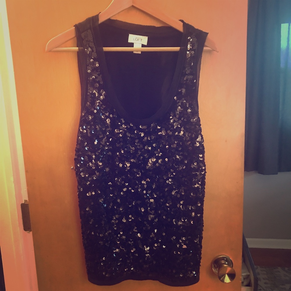 A black sequined tank